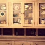 Trompe L'oeil dishes in a cabinet